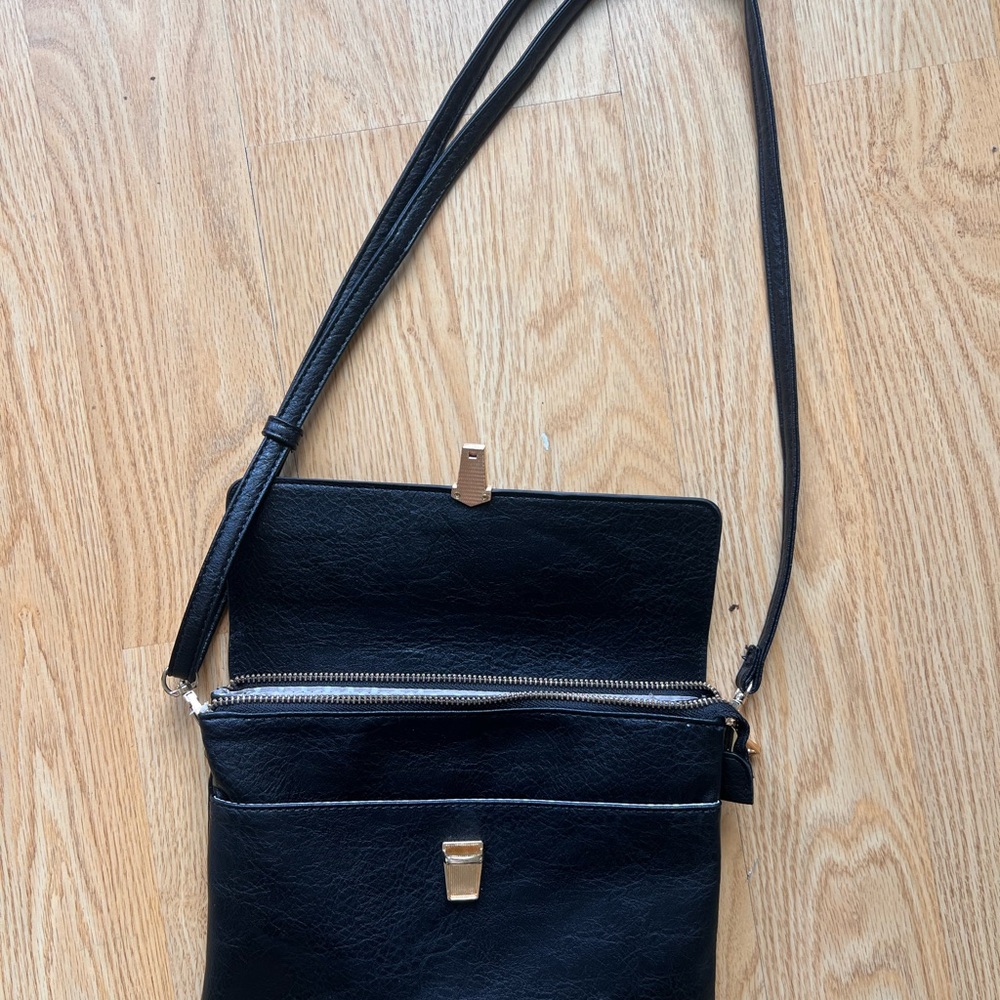 Sleek Black Crossbody Bag with Gold Accent